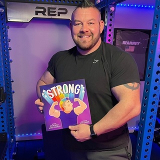Gay author Eric Rosswood (@ericrosswood) wants LGBTQ+ kids to believe in themselves. In his new children's book "Strong," Rosswood tells the story of Rob Kearney (@worlds_strongest_gay), a gay strongman who trains himself to lift hundreds of pounds. As the story progresses, Kearney learns with the help of his husband to fully embrace who he is without worrying about what other people think of him. Rosswood co-authored the book with Kearney. The book is short, simple, and to the point. Each page features a drawing by Nidhi Chanani (@nidhiart). Each drawing comes with a short text that tells Kearney's story. The book poses a simple question for its readers: What makes you strong? In Kearney's case, his strength comes from not only his ability to lift heavy weights, but also from his ability to proudly be who he is. In an interview with our friends at @BayAreaReporter, Rosswood revealed that he first discovered Kearney's story in an online article and was quite taken with him. He found the story inspiring and felt that it would also inspire young people. The book follows Kearney through his childhood, when he was found to be an unusually strong kid. When he was 17, a teacher introduced him to Strongman, a competition which tested strength. Kearney began training. He ran, swam, and lifted weights, eventually being able to lift four hundred pounds. Whenever he finished training, Kearney would change into his colorful street clothes, which he felt were more representative of him. At one weightlifting event, Kearney meets Joey, and the two fall in love. Joey notices that Kearney always changes into drab colored clothes when he lifts weights, saying that strongmen don't wear bright colors. "Well then," said Joey. "I'll wear bright colors with you."⁠
⁠
Tap link in bio to continue on @EDGEmedianetwork⁠
?????️‍???‍♀️⁠
?️: David-Elijah Nahmod⁠
?: Rob Kearney @worlds_strongest_gay