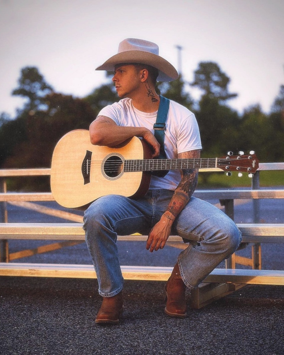 Social media has a way of spreading even the most niche types of tunes and musical mashups together, delivering unique sounds and unconventional genre twists of tired song tropes. Country music is traditionally associated with rural America, Southern small-town demographics that skew politically and culturally conservative, and therefore often anti-LGBTQ+. The genre is also seeing a comeback on the charts, with controversial country stars @morganwallen and @jasonaldean (who has recently doubled-down on his drama) having songs in Billboard's Hot 100 top 10. (Additionally, @lukecombs' unnecessary cover of out singer Tracey Chapman's iconic "Fast Car" is also in the top 10.) Country music has only welcomed a few queer singers like @orvillepeck, @tjosborne, @brandicarlile, and even @lilnasx. Breaking into the industry can be difficult, but the viral sensation @iamdixondallas has brought country music to the mainstream, but with an extremely gay spin. Dallas, whose real name is Jake Hill (@iamjakehill), has not identified if he is gay or a part of the LGBTQ+ community, but he's picked up a lot of steam on @Twitter and @TikTok, thanks to his highly sexualized gay ballad, "Good Lookin.'" Using traditional country music tropes, like descriptive romantic verses and singing in a deep southern drawl, Dallas' music is everything a country music fan has come to know and love except it comes with an explicit gay twist. In particular, Twitter users were obsessed with the lyrics.⁠
⁠
Save this post and tap our link in bio for more on @EDGEmedianetwork.⁠
?️‍⚧️?️‍?????❤️⁠
?: @iamjakehill @iamdixondallas