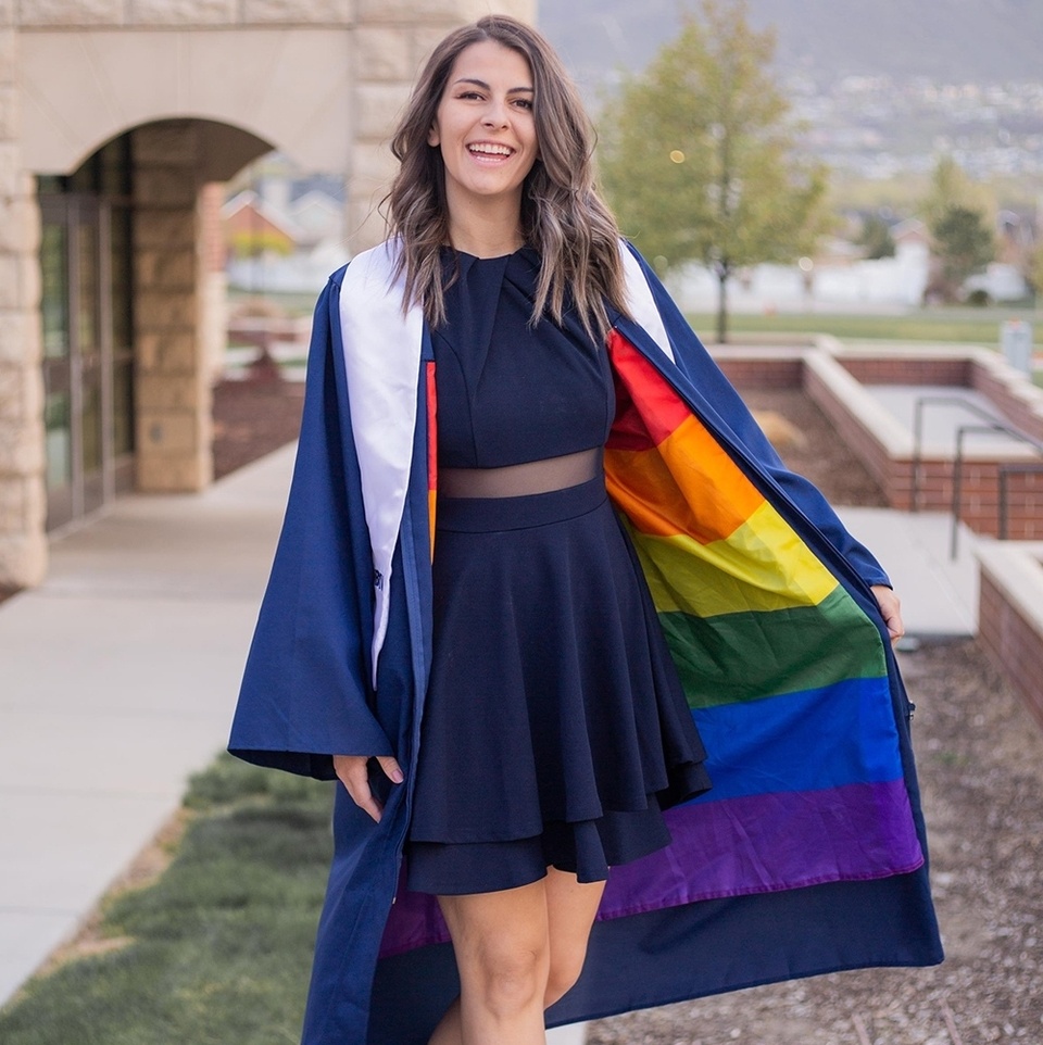 BYU student @jillianoreo bravely flashed a Pride flag at her graduation. Now, the bisexual grad says she's ready for whatever's next, People Magazine reported. The infamously conservative school has an "honor code" that denies legitimacy to same-sex relationships. "I don't know if they are allowed to take away my degree," Orr told People. "I don't know if they're allowed to freeze my transcripts." Whatever BYU might do, "I'm ready to face it and take accountability and own that," Orr said, "because I'm not ashamed of what I did because I understand that there may be negative consequences to choosing what is right." As previously reported at EDGE, Orr, 28, flung her gown open during her graduation to reveal a Pride flag sewn inside as a lining. She later shared her story in a video on TikTok, as well as on Facebook. The story instantly went viral. In her video, Orr had explained that the school could punish LGBTQ+ people in same-sex relationships by expelling them and revoking their degrees, and said that because of this hard-line stance, LGBTQ+ students remained in hiding until after graduation. "I will not hide," Orr declared in her social media posts. "I will be seen."⁠
⁠
Tap link in bio to continue on @EDGEmedianetwork⁠
?️‍??????⁠
?: Jillian Orr / @jillianoreo