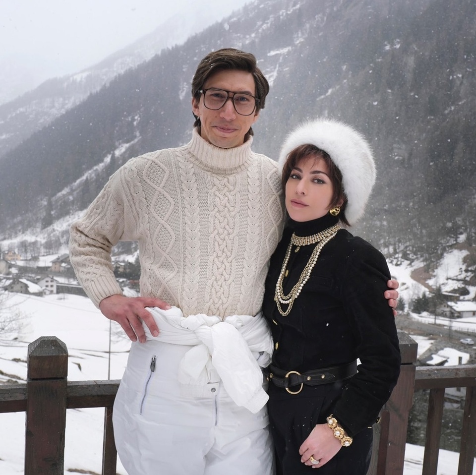 Lady Gaga shared the first look at "House of Gucci," the new Ridley Scott thriller starring the pop singer and Adam Driver. In the upcoming film, Gaga plays Patrizia Reggiani, Maurizio Gucci's ex-wife. Variety writes it "depicts the true story of the downfall of the Gucci family dynasty. Adam Driver is portraying Maurizio Gucci, the former head of Gucci fashion," going on to say the movie "dramatizes the events around the assassination of Guccio Gucci's grandson, Maurizio. Patrizia Reggiani was tried and convicted of orchestrating Maurizio Gucci's murder in 1995 after he left her for a younger woman. She served in prison for 18 years, where she gained the nickname Black Widow, before being released in 2016." "House of Gucci" was written by Roberto Bentivegna and is based on the novel "The House of Gucci: A Sensational Story of Murder, Madness, Glamour, and Greed" by Sara Gay Forden. Al Pacino, Jared Leto and Jeremy Irons also star. This marks Gaga's first film role since her performance in the blockbuster "A Star is Born," starring and directed by Bradly Cooper. She was nominated for a Best Actress Oscar but went home with the award for Best Original Song for "Shallow." "House of Gucci" is expected to hit theaters on Nov. 24. Tap link in bio to continue on @EDGEmedianetwork ?️? (?: Adam Driver, left, and Lady Gaga, right, for "House of Gucci." / Twitter, Lady Gaga)