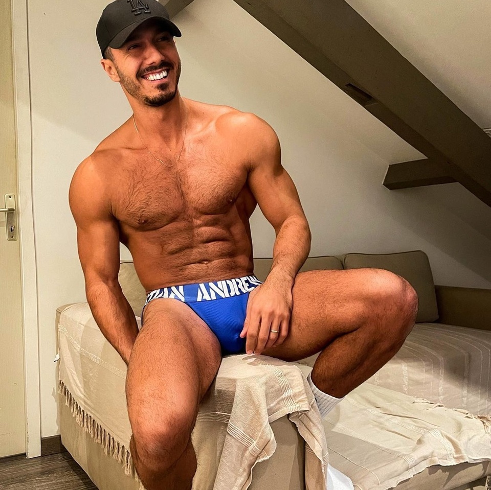 Fans of the TV Show "Below Deck" are getting to know one of its stars a lot more intimately. Recently the gay adult studio Raging Studio released "its first-ever scene with Bravo reality star Lobo Carreira — someone who you may know as Bruno (Bruno Duarte Vincent) from the fifth season of 'Below Deck.'"writes the adult gay reporting website The Sword. "Bruno is an openly gay man and some of the struggles he's had with his sexuality were documented on the show. In 2017, Bruno got engaged to his partner, Joseph, and they were both overjoyed. Although the two appear to still be together, they have not yet tied the knot," reported the website tvovermind two years ago. This isn't Bruno's adult gay film debut. Previously he made a scene for Colt with his partner Jose (Joseph) in 2020. "I am a huge fan of "Below Deck" and a friend of mine was on the show as a guest and on that episode, I saw Bruno in his red, starred swim suit where he has to be a table decoration during a 'Naked Sushi' dinner," Colt director and owner John Rutherford said in a release. The scene is pretty infamous at this point. "I had written him on [Instagram] telling him I was a big fan and thought he looked great. We stayed in touch and because Bruno and Jose live in the South of France, so we met up in Paris and decided to do a photo shoot and video with them both. We wanted it to be erotic and intimate.... The rest is history, as they say."⁠
⁠
Tap link in bio for more on @EDGEmedianetwork ⁠
????⁠
?: @belowdeckbruno