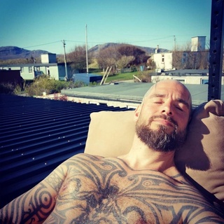 In a case of politics and porn making strange bedfellows, tatted, ex-adult film star Philipp Tanzer wouldn't appear to be a logical choice for the ultra-conservative, anti-LGBTQ Scottish Family Party. Tanzer is better known as his adult film alter-ego, Logan McCree, "who made a number of gay porn flicks with Raging Stallion and other studios, and won awards while working in the adult industry, including a Grabby and a GayVN Award," EDGE previously reported. But he was the SFP's choice, ran, and lost this weekend in the Scottish election. He announced his candidacy this past April, Tanzer jumped into politics for a seat in the Scottish parliament as a candidate for the party. The German-born, former bodybuilder had moved to the small Scottish town of Durness in 2012, where he joined the local fire department in 2015 without anyone finding fault with his past in gay porn. Tap link in bio to continue on @EDGEmedianetwork (?: Philipp Tanzer / Instagram / @philipptanzer) 