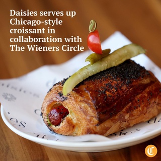 For pastry chef Leigh Omilinsky, her most recent creation has a personality. It’s particular, stubborn and judgmental. In other words, it’s quintessential Chicago.

@daisieschicago, a Midwestern pasta restaurant in Logan Square, debuted its newest pastry — the Chicago-style croissant. The dish, which features a charred Vienna beef hot dog wrapped in a croissant, is a collaboration with @wienerscircle.

The $8.50 croissant is also stuffed with yellow mustard, diced onions, celery salt and bright green relish. On top, there’s poppy seeds and a garnish of a cherry tomato, pickle and sport pepper. Omilinsky’s nicknamed the creation a “glamour weenie” or a “grown-up pigs in a blanket.”

Tap on our bio link to read more.⁠

? Rebecca Johnson / Chicago Tribune⁠
?️ Antonio Perez / Chicago Tribune⁠