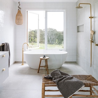 Serene vistas and sustainability define this stunning build in Winchelsea, Victoria. "Every morning when we wake up to that breathtaking view, we have to pinch ourselves [to remind us] that this is really where we live," says Marg, who relishes a newfound country life alongside her husband, builder Steve.⁠
⁠
The property, which was largely ideated and constructed by Steve and his company, Wade Builders, features a timeless white-on-white palette, concrete slab floors, a large farmhouse kitchen and - the heart of the home - a Cheminées Philippe fireplace. "We find ourselves not wanting to go anywhere – we just stop and enjoy everything we have here."⁠
⁠
Step inside via the link in bio.⁠
⁠
Photography: @marniehawson⁠
Styling: @bellebrightproject⁠
Words: @abby__may⁠
⁠
#bathroomdesign #laundrydesign #countryhome #concretefloors #freestandingbath