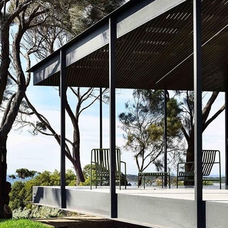 "I wanted something that was light, and that was nestled in the environment, and so the brief to the architect was to build something that didn't impact too much on the land," says Lizzie, the owner of this modern #coastalhome on Victoria’s #MorningtonPeninsula.⁠
⁠
The result is a deceptively simple form — virtually a glass, timber and steel #pavilion that seems to float above the ground.⁠
⁠
Tap the link in our bio to take a tour. ⁠
⁠
Photography: @derek_swalwell⁠
⁠
#australianhomes #australianarchitecture #bushhome #verandah