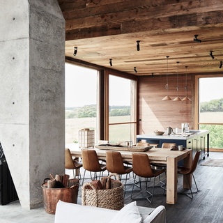 In this cabin-like home, rooms are enveloped in natural textures and tones of aged timber, contrasting with the angular sculptural concrete chimney that functions as both flue for the wood-burning heater and a room divider. "It's an art piece in itself," says owner Fran, who wanted to showcase the home's timber tones. ⁠
⁠
Tap the link in our bio to see more of @thewensley, a unique country escape on Victoria’s Surf Coast. ⁠
⁠
Photography: @lisacohenphoto / Styling: @tess.newman.morris⁠
⁠
#timberhome #GreatOceanRoad #diningroom #Australianhomes⁠
⁠
