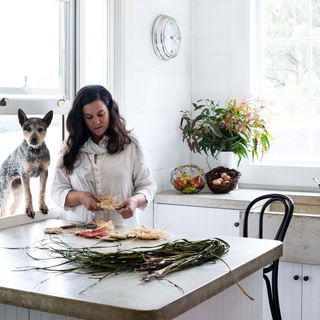 At Christmas time, Brooke and Colin Munro decorate their storybook pretty home with handmade creations woven from raffia. Here, Peggy the cattle dog watches intently as Brooke works her weaving magic. ⁠
⁠
Before renovations, however, their 1970s farmhouse was in a state of disrepair. But the pair channelled their efforts into rebuilding the floors, ceiling, roof and re-cladding upstairs and downstairs. ⁠
⁠
Tap the link in our profile to see what the home looks like today. ⁠
⁠
Photography: @brigidarnottphotography⁠
Styling: Hannah Brady⁠
Words: @alexspeedjournalist⁠
⁠
#whitekitchen #christmasdecorating #concretebench #farmhousekitchen #renovation⁠

