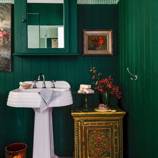 Seeking a simple life, UK-born Rachel Waller found herself in this gorgeous, petite cottage on Lake Weyba, on Queensland's Sunshine Coast. "It's taught me that you can live very well in a small way, and you can be extremely content with less," she says.⁠
⁠
Filling her home with a curated selection of travel finds and vintage objects has become something of a passion for Rachel. In her stunningly green bathroom, an Art Deco sink sits next to a decorated chest found in an English antiques store.⁠
⁠
Take a tour via the link in bio.⁠
⁠
Photography: @hannahpuechmarin⁠
Styling: Cheryl Carr⁠
Words: Sue Ramsey⁠
⁠
#greenbathroom #vintagesink #artdecosink #antiques #vintagefurniture