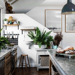 Despite being a new build, there's nothing sterile or lacking in personality about this modern barn-style home on Lake Conjola.⁠
⁠
In the kitchen, salvaged timber drawer fronts, salvaged old factory pendants, and a concrete bench poured on-site add the kind of warmth only a rustic, country style home can possess. "I love working with textures and neutral colours. Straw, timber, concrete: they're my favourites," says Leah Atkins, who built this home alongside her husband. "I like to create little vignettes, to make a home feel like home."⁠
⁠
Take a tour via the link in bio.⁠
⁠
Photography: @brigidarnottphotography⁠
Styling: @hannah.brady⁠
Words: @becwhish⁠
⁠
#timberkitchen #countrykitchen #concretebench #kitchenpendants