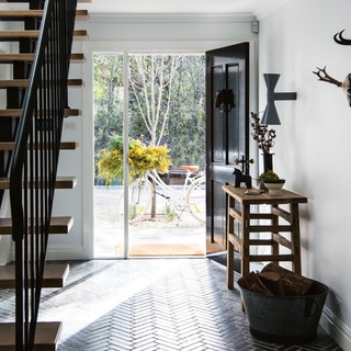 The NSW #BlueMountains holds many precious childhood memories for Kasturi and Simon Wren, who decided to build their dream home surrounded by the rambling wilderness of small town Leura.⁠
⁠
While the home itself is modern, a classic monochrome palette combined with #rustic furniture and charming details, like this herringbone floor in the #entryway, instil character and warmth.⁠
⁠
Tap the link in our bio to take a tour. ⁠
⁠
Photography: @brigidarnottphotography / Styling: @johnmangila⁠
⁠
⁠

