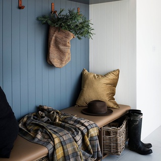 On a former sheep property in the NSW Southern Tablelands, a family have created a rammed earth farmhouse and converted a set of old stables into a welcoming guest house. ⁠
⁠
Here, the entrance of the guest house has been decorated with fresh foliage, woven storage baskets and a cosy woollen throw.⁠
⁠
Tap the link in our profile to take a tour of the property.⁠
⁠
Photography: @brigidarnottphotography⁠
Styling: Jodie Gibbons @belljarinteriors⁠
Words: Bronwyn Phillips⁠
⁠
#homeentry #christmasdecorating #hallwaystorage #entrancestyling #homeconversion