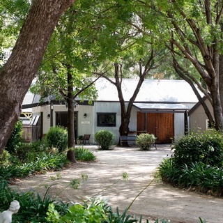 Visitors to Mudgee in NSW's central west can rest and recharge at this leafy sanctuary where four-legged friends are welcome.⁠
⁠
"Dogs are part of the family," says owner Stacey Stoddart, who purchased Evanslea along with her husband Phil, in 2017. ⁠
⁠
"I love making people feel special and Phil loves plants so the property ... offered us both an amazing business opportunity in which we could further develop our passions while working together." ⁠
⁠
Tap the link in our bio to take a tour of the historic property. ⁠
⁠
Photography: @brigidarnottphotography⁠
Words: @clairemactaggart⁠
⁠
#shedhouse #homeconversion #renovation #evergreengarden #frontgarden #countryhome