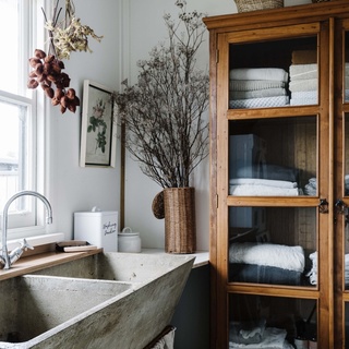 The laundry is one of the hardest-working rooms in the house. But that doesn't mean it can't be stylish! ⁠
⁠
At Moonliters Cottage in Anglesea, VIC, owner Gemma Grange embraced a vintage look. An old concrete sink sourced from a local cafe takes pride of place, wrapped in a linen skirt sewn by her mum.⁠
⁠
For more inspiring laundry ideas, tap the link in our profile. ⁠
⁠
Photography: @marniehawson⁠
⁠
#laundrydecor #laundrystorage #laundryrenovation #cottagelaundry #cottagestyle