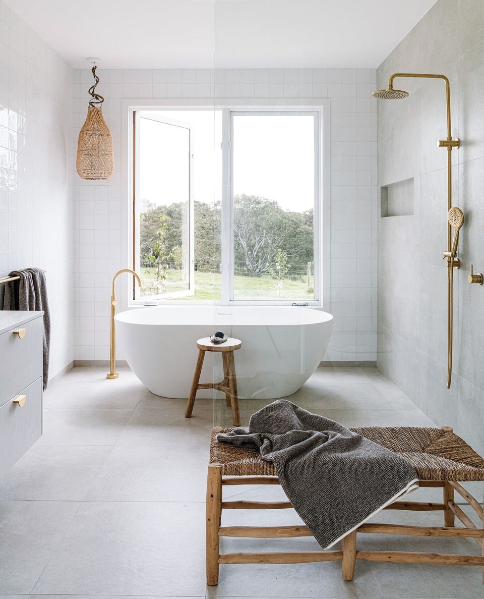 Serene vistas and sustainability define this stunning build in Winchelsea, Victoria. "Every morning when we wake up to that breathtaking view, we have to pinch ourselves [to remind us] that this is really where we live," says Marg, who relishes a newfound country life alongside her husband, builder Steve.⁠
⁠
The property, which was largely ideated and constructed by Steve and his company, Wade Builders, features a timeless white-on-white palette, concrete slab floors, a large farmhouse kitchen and - the heart of the home - a Cheminées Philippe fireplace. "We find ourselves not wanting to go anywhere – we just stop and enjoy everything we have here."⁠
⁠
Step inside via the link in bio.⁠
⁠
Photography: @marniehawson⁠
Styling: @bellebrightproject⁠
Words: @abby__may⁠
⁠
#bathroomdesign #laundrydesign #countryhome #concretefloors #freestandingbath