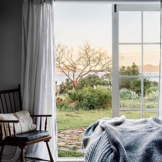 Gentle waves, sheer curtains blowing on a sea breeze and craggy coast-meets-bush views are the norm at The Burrows in Swansea.⁠
⁠
Inviting disconnect and relaxation, the restored holiday cottage was originally intended as a bolthole for owners Bek Burrows and Paul DeRuyter. "The beds are sumptuous, but the doors are old, the laundry has a concrete floor, and there's no dishwasher," says Bek. "It's not about living with the latest appliance or technology." ⁠
⁠
Step inside via the link in bio.⁠
⁠
Photography: @adam.gibson.photo @abbie_melle⁠
Styling: @bellebrightproject @lynda.gardener⁠
Words: @hilaryburden⁠
⁠
#tasmania #cottage #coastalcottage #holidayhome #weatherboardhome