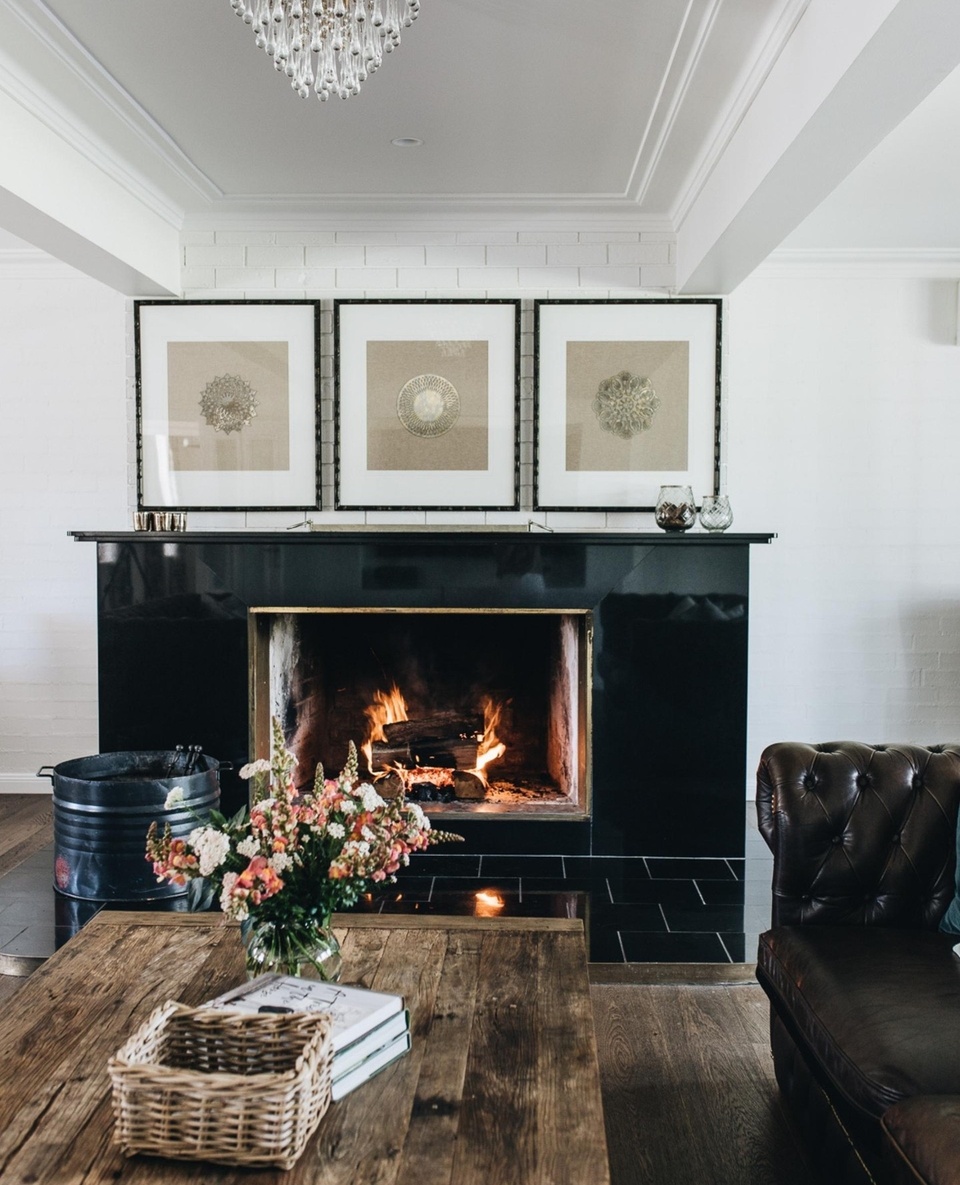 Thoughtfully designed to carry guests from the region's steamy summers into its chilly winter months, Bundara Farm at Berry is practically purpose-built for gathering.⁠
⁠
From cosy fireplaces to long tables shrouded with climbing grapevine, each space within this divine accommodation invites relaxation and retreat.⁠
⁠
Step inside via the link in bio.⁠
⁠
Photography: @abbie_melle⁠
Words: @lucycf94⁠
Location: @bundarafarm⁠
⁠
#fireplace #leathersofa #chandelier #countrylivingroom #berrynsw