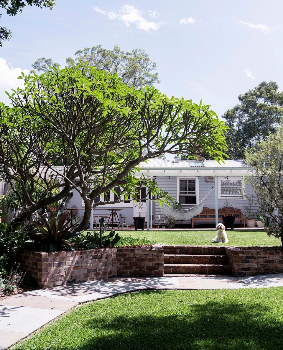 Four years ago, Maryann and Brian Walker had been toying with the idea of a sea change when an old miner's cottage, just minutes from the beach, challenged them to take it on. ⁠
⁠
After extensive renovations, they named the cottage Flora House, after Brian's grandmother "who lived family and a warm house filled with laughter." ⁠
⁠
Tap the link in our profile to step inside. ⁠
⁠
Photography: @brigidarnottphotography⁠
Styling: Jodie Gibbons @belljarinteriors⁠
Words: @justicelyn⁠
⁠
#frangipanitree #coastalcottage #cottagerenovation #recycledbrick #coastalgarden