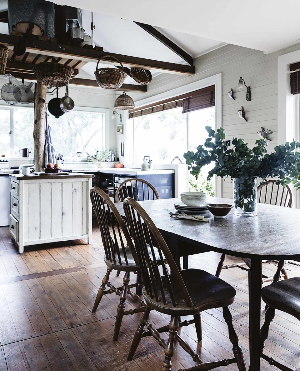 Exposed timber beams and large windows frame the bushy outlook of this ever-changing Blue Mountains home.⁠
⁠
Rustic and completely charming, this Mount Tomah property has been through more than a few reinventions, starting out as a single-room cabin and later extended as the owners' lives evolved. But – matter how many changes are made, time spent here remains more or less the same; mornings starting with hot bowls of porridge, slow-cooked overnight in the oven of the 1950s AGA.⁠
⁠
Step inside via the link in bio.⁠
⁠
Photography: @mareehomer.photography⁠
Styling: @kerrieann_jones_stylist⁠
⁠
#rusticcabin #bluemountainsnsw #cabin #timberbeams 