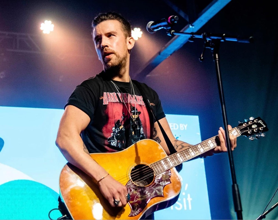 "I instantaneously felt like I wish I had done this a long time ago," country singer TJ Osborne told Ellen DeGeneres during a recent appearance on her talk show. The singer stopped by "Ellen" by way of a video chat last week, a day after TIME Magazine ran an interview in which he came out as gay. Calling the response to his coming out "wild," Osborne, 36, went on to say that the "wave of love" that greeted him made for "a very emotional day." DeGeneres sympathized, nothing that "straight people don't ever have to shove something down and then all of a sudden say to someone, 'I'm straight!' "I was asked, like, 'Why do you have to do this?' " Osborne said in response. "And in a perfect world I wish I didn't have to." The star went on to share that, "I kind of got to this point to where I knew that there was never going to be the perfect time" to come out. Now that he's accomplished that feat, Osborne said he now knows that "the perfect time is always now." As many LGBTQ people have upon coming out, Osborne described his embrace of authenticity as "a weight off of my shoulders" - an oppression replaced by the liberating sense that he's now been welcomed for who he really is. "People that I feel like personify masculinity and the straight culture" were "coming out with a lot of pride for me," Osborne told Ellen. "That was really the moment to me that made me feel like, 'Wow, that was there the whole time.'" Tap link in bio to continue on @EDGEmedianetwork ?️‍?????⁠
⁠
?️: Kilian Melloy / @dragelruairi ⁠
?: Amy Harris / AP