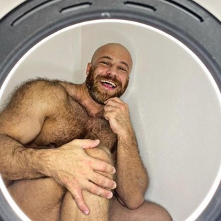 Could Kazakhstan bodybuilder Yuri Tolochko (them/they) be reaching a new stage in their relationships? Tolochko made international headlines when they married a human-sized doll, named Margo, in November, 2020, in a ceremony they published on social media. EDGE reported at the time that the "hunky, bearded Yuri wore a black dinner-suit and bow tie, and the Melania-like Margo wore a long white lacy wedding gown. A few dozen guests watched as Yuri glided Margo around the dance floor in the traditional 'first dance'." It looked like a storybook wedding, save one thing: "the bride was a synthetic sex doll, that Yuri actually proposed to in December 2019," reported the Euro Weekly News website. The marriage went sour, though, after Margo broke and they had to send her to be repaired right before Christmas. Four months later, they divorced Margo. "We broke up with Margo. I'm not ready to talk about the reasons for the divorce yet," they told the Daily Star. Since then, they introduced "a chicken sex toy and an Asian sex doll called Luna," wrote the Daily Star. But this week they may be moving away from inanimate sex objects, posting on Instagram: "My harem and I have a new experience. I decided to try ourselves as a rental family." The man's face is not seen in the video, which starts with Yuri and the mystery man combing Luna's hair before they turn their attention on each other. "Luna has a headache all day today. We are trying to help her," they writes on Instagram. Tap link in bio to continue on @EDGEmedianetwork ?️‍???? (?: Yuri Tolochko / @yurii_tolochko)