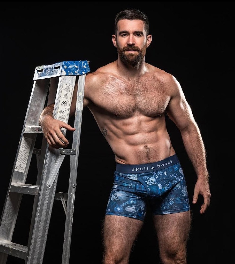 #EDGERewind :: Former gay adult star Woody Fox, who hails from Australia, joined his industry colleagues on an edition of the Australian Broadcast Company's "You Can't Ask That" to talk about the ins-and-outs of the industry. The lean, bearded 33-year-old performer, who retired from the industry in 2019, offered insights and advice from his years working in porn. He joined a number of his colleagues, both male and female, in the segment. Over his career, Fox worked for such companies as Falcon, Hard British Lads, Hot House, Lucas Entertainment, Men.com, Raging Stallion, Naked Sword, and more. He has an OnlyFans account, where he describes himself as "masc, Aussie, acrobat with a cheeky past." Fox discussed his first porn shoot, which was reported by the Star Observer. "I didn't know if I was going to get hard," he joked. "I didn't know if I was going to poop myself." My first shoot was terrifying." Fortunately, he continued. "The first one didn't have a script. Here's some mats, here's some positions." "We had about 10, 20 minutes to get to know each other. As in like 'Hi, how are you? Where are you from? If I bite your ear is that going to be a turn-off?' Just really, really quick. It was more about making sure he was comfortable, sliding in." He also said that despite the content, the main thing about working on a porn set "is that it's not sexual." "There'll be moments where you're starting to connect with a scene partner," he said. "And then there'll be a voice saying, 'Just turn out,' or, 'Hey, we need make-up on the hole.'" Fox discussed an embarrassing moment while filming a rimming scene. "I've pulled these cheeks open and I've been sprayed with douche water," he said. And he admitted that there are definitely size requirements in the industry. "So you'll never really see someone below eight inches in porn," he said.⁠
⁠
Tap link in bio for more on @EDGEmedianetwork ⁠
????⁠
?: @woodyfox_official