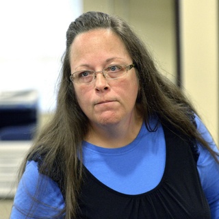 A federal judge has ruled that a former Kentucky clerk violated the constitutional rights of two same-sex couples who were among those to whom she wouldn't issue marriage licenses — a refusal that sparked international attention and briefly landed her in jail in 2015. U.S. District Judge David Bunning in Ashland issued the ruling Friday in two longstanding lawsuits involving Kim Davis, the former clerk of Rowan County, and two same-sex couples who sued her. With the decision, a jury trial will still need to take place to decide on any damages the couples could be owed. Bunning reasoned that Davis "cannot use her own constitutional rights as a shield to violate the constitutional rights of others while performing her duties as an elected official." "It is readily apparent that Obergefell recognizes Plaintiffs' Fourteenth Amendment right to marry," the judge wrote, referencing the landmark same-sex marriage Obergefell decision. "It is also readily apparent that Davis made a conscious decision to violate Plaintiffs' right." Soon after the 2015 Supreme Court decision in which same-sex couples won the right to marry nationwide, Davis, a Christian who has a religious objection to same-sex marriage, stopped issuing all marriage licenses. That led to lawsuits against her, and a judge ordered Davis to issue the licenses. She was sued by gay and straight couples, and spent five days in jail over her refusal.⁠
⁠
Tap link in bio to continue on @EDGEmedianetwork⁠
?️‍????⁠
?: Kim Davis / AP