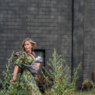 In 2018, "A Quiet Place" pleasantly surprised us. It was a film that overcame its glaring plot holes and banalities (and boy, were there plenty) with ambitious world-building, strong performances (especially by Emily Blunt and Millicent Simmonds), great setups and executions (that nail!), and absolutely stellar sound work (perhaps the scariest thing about the whole film is how it lost its deserved Best Sound Editing Oscar win to - *checks notes* - "Bohemian Rhapsody"). It was an effective chiller and thriller alike; it knew when to fine tune the moments of silence, and when to pull out the big guns when the volume eventually increased. Three years later, "A Quiet Place Part II" left us unfulfilled and underwhelmed, despite the film sharing many of the first installment's strengths and even building on them on multiple occasions. After an extremely solid opening sequence that shows us the inciting events of the alien invasion we were plopped into during the first film, "Part II" picks up exactly where its predecessor ended. But it meanders from there, not finding much footing until there's about a half hour left in the run time and things finally start getting a bit interesting. And that's completely fine. If anything, the strikingly familiar mediocrity of watching an immediately forgettable blockbuster horror sequel in a shoddy, corporate multiplex made us experience a sense of normalcy we haven't felt in quite some time. Tap link in bio to continue on @EDGEmedianetwork ??️? (?️: Greg Vellante, ?: Evelyn (Emily Blunt) braves the unknown in "A Quiet Place Part II.” / Paramount)