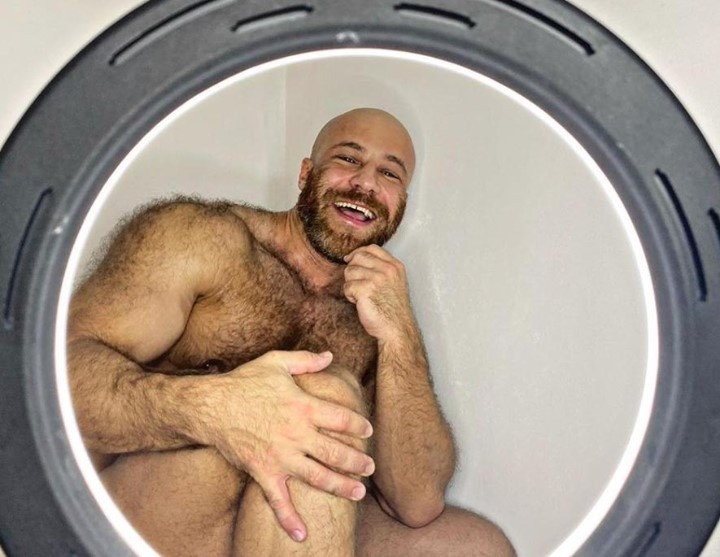 Could Kazakhstan bodybuilder Yuri Tolochko (them/they) be reaching a new stage in their relationships? Tolochko made international headlines when they married a human-sized doll, named Margo, in November, 2020, in a ceremony they published on social media. EDGE reported at the time that the "hunky, bearded Yuri wore a black dinner-suit and bow tie, and the Melania-like Margo wore a long white lacy wedding gown. A few dozen guests watched as Yuri glided Margo around the dance floor in the traditional 'first dance'." It looked like a storybook wedding, save one thing: "the bride was a synthetic sex doll, that Yuri actually proposed to in December 2019," reported the Euro Weekly News website. The marriage went sour, though, after Margo broke and they had to send her to be repaired right before Christmas. Four months later, they divorced Margo. "We broke up with Margo. I'm not ready to talk about the reasons for the divorce yet," they told the Daily Star. Since then, they introduced "a chicken sex toy and an Asian sex doll called Luna," wrote the Daily Star. But this week they may be moving away from inanimate sex objects, posting on Instagram: "My harem and I have a new experience. I decided to try ourselves as a rental family." The man's face is not seen in the video, which starts with Yuri and the mystery man combing Luna's hair before they turn their attention on each other. "Luna has a headache all day today. We are trying to help her," they writes on Instagram. Tap link in bio to continue on @EDGEmedianetwork ?️‍???? (?: Yuri Tolochko / @yurii_tolochko)