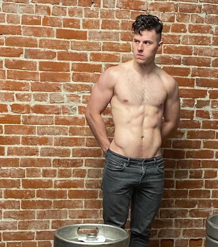 Nolan Gould grew up before America's eyes playing Luke Dunphy on "Modern Family" for eleven years. But today he's a hunky, 22-year-old who, the New York Post reports, "shocked fans with a raunchy pole dancing video proving he is no child actor anymore." "Tragic Mike," he jokes in his post. "Might delete this immediately but had to share the results of my first pole dancing class. Always wanted to try it. Thanks @alyssadventures for an amazing class and my supportive friends for helping make it happen. I am uncoordinated and inflexible as hell. My body is basically made of Lego bricks." If his body is made of Lego bricks, it is certainly a well-constructed one. Over the pandemic Gould has worked with a personal trainer and changed to a healthier diet. "I've been working out an hour and a half everyday with my friend Michael who is a personal trainer," he told People magazine last February. "We have a really cool socially-distant setup that has allowed me to get fit while also being safe. It's been nice. Especially being unemployed in quarantine, having a reason to get up and stay motivated. It's been something that's been very healthy and positive for me in quarantine. It's really changed my outlook." He also told People he's been on a "pretty crazy diet," which consists of lots of lean protein and vegetables, and no more "teenage boy/bachelor"-type meal plans where you skip meals and then end up eating "four pizzas at once." He continued: "I'm eating so much healthier, even though there's less of it," he says. "What I get is actually really healthy food for you: lean protein, eating as many vegetables as you want and staying away from things like soda." Tap link in bio to continue on @EDGEmedianetwork ???? (?: Nolan Gould / Instagram)