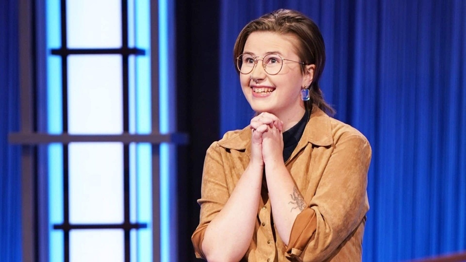 Out Canadian Mattea Roach continues her winning streak on "Jeopardy," and is again bringing queer representation to the forefront on the popular quiz show. Earlier this year trans contestant Amy Schneider had a streak of 40 wins, second only to the show's current host, Ken Jennings, who won 74 straight wins in 2004. But for Roach, sexuality is not all that germane to her winning streak, though she has been open about it. "She hasn't made a big thing out of her sexuality, but nor is it a secret," writes the website Coast Reporter. "Her Twitter bio, which reads "lesbian, Nova Scotian, 19x Jeopardy champ," was deliberately crafted to satisfy viewers' curiosity because she figured people might wonder." With her wins, Roach is the sixth-longest running contestant in "Jeopardy" history. "Her cumulative winnings now total over $460,000 as of her 19th game Friday, and she boasts a 92% accuracy rate in her responses, per 'Jeopardy!'," reports CNN. "Roach is also the latest LGBTQ 'Jeopardy!' super-champion after Amy Schneider's triumphant run on the show. Schneider, a trans woman, earned more than $1.3 million in a 40-game win streak earlier this year, one of the longest streaks in the show's history," CNN adds. "It's been such an honor and a pleasure to be part of what has been such an incredible a legacy of queer and trans champions," Roach said in an interview with GLAAD, the LGBTQ media advocacy organization. "And also just queer and trans contestants really, like, showing up on the show and bringing a lot of flavor, I think, has been really fun for me to watch as a viewer."⁠
⁠
Tap link in bio to continue on @EDGEmedianetwork⁠
?️‍????⁠
?: CBC