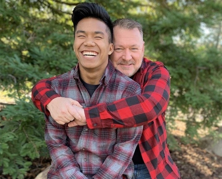 Jordan Windle — also known as "Little Louganis," a nickname that hearkens back to the out Olympic champion who took the gold in 1984 and 1988 — is headed to the Olympics in Tokyo this summer. And his out gay dad, Jerry Windle, will be there to watch him compete. Jordan's Olympic journey began, improbably enough, in his birthplace of Cambodia, NBC Sports recounted. His parents died when he was still an infant, but he was adopted by Jerry Windle, "an American who had reportedly struggled to adopt in the U.S. as a single, gay man." Per the article, Jerry "adopted Jordan when he was 18 months old and helped nurse him back to health from malnutrition, scabies, intestinal parasites and severe infections. When Windle was 7, he attended a summer camp where he was spotted by Tim O'Brien, the son of Hall of Famer diving coach Ron O'Brien." That connection seemed freighted with destiny, as it turned out. "O'Brien had seen something in Windle that reminded him of one of his father's most decorated divers: Four-time Olympic champion Greg Louganis," Olympics.com notes in its profile on Jordan. "It prompted the nickname 'Little Louganis.'" Jordan proved O'Brien right: He won "four U.S. junior titles," Outsports.com recalled. "Along the way, Jordan and Jerry co-authored a children's book based on their family experience called, 'An Orphan No More: The True Story of a Boy.'" Tap link in bio to continue on @EDGEmedianetwork ?️‍???‍♂️? (?️: Kilian Melloy / @dragelruairi , ?: Jordan Windle / Instagram / @jordanpiseywindle)