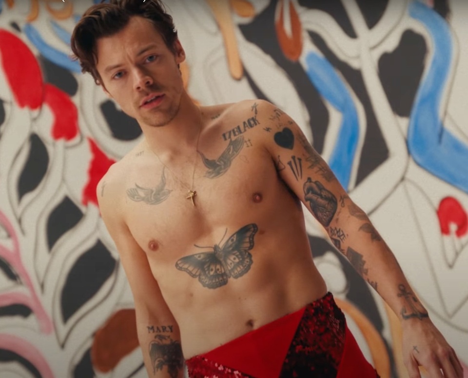 With a new album and film on the horizon, Harry Styles is entering a new era. Styles spoke with Capital FM's Roman Kemp for a new interview where the pop star and actor opened up about the sex scenes in his two upcoming films "My Policeman" and "Don't Worry Darling." "I don't know if you can watch either with your parents," Styles, 28, said of the movies, both set to hit theaters this fall. "I'm gonna have to do another one." Kemp followed up by asking if the movies will have any "saucy scenes" that involve Styles, to which he replied, "Yes." Asked if he will be naked, or if he wore a "netball," the musician said he "personally had no experience with a netball. It depends very much on who you're working with and what the situation is." "All I can say, from my experience, is that we were very lucky to have a trusting relationship with the people we were working with and that came first," Styles went on to say. "It was all discussed and all of it was very OK, above the filming, above the camera, it's me and you and we trust each other and at any point we can stop whenever." Based on the Bethan Roberts 2012 novel, "My Policeman" is set in the 50s in Brighton, England and follows a gay policeman named Tom (Styles) as he marries Marion (Emma Corrin), a school teacher, while he is in a relationship with a museum curator named Patrick (David Dawson). "Don't Worry Darling" is a thriller directed by Olivia Wilde, who is currently dating Styles. That film is also set in the 50s. It follows an unhappy housewife played by Florence Pugh as she discovers a dark truth about her husband, played by Styles.⁠
⁠
Tap link in bio to continue on @EDGEmedianetwork⁠
????⁠
?: Harry Styles in his video "As It Was" / YouTube⁠
@harrystyles