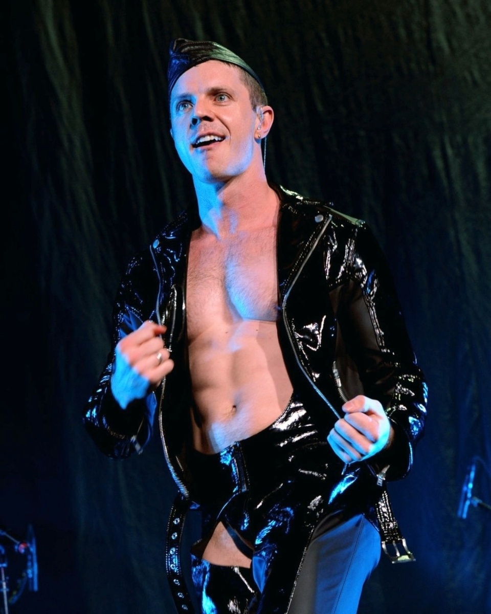 "I got here a year ago," former Scissor Sisters front man @jakeshears tells EDGE from Glasgow, where he's preparing to launch a concert featuring music from his new album, "Last Man Dancing." He's not referring to Scotland per se, but rather to the UK in general, having relocated to London. "I really miss New Orleans a lot," the pop star adds. "I miss my friends in the States. I miss my mom and dad." He goes on to lament the death of his beloved dog, who he'd brought along on the move. But life for Shears has been going full-tilt, and it doesn't sound like he's had much time to brood. "Between the Tammy Faye musical" – for which he wrote the lyrics to Elton John's music – "the album stuff and everything I've been working on, it's been a lot," Shears adds. No kidding: He toured with Duran Duran earlier this year, in addition to finishing the new album and making a handful of videos to go along with it, including the mini-movie set to "Too Much Music," the album's opener, which sees Shears starring in a neo-noir with DL gay overtones. ⁠
⁠
Save this post and tap our link in bio for more on @EDGEmedianetwork.⁠
????⁠
?: @jakeshears
