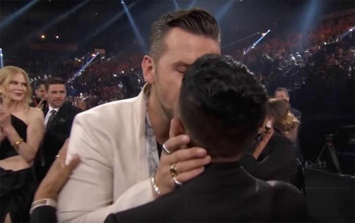Out country music star T.J. Osborne made history when he sealed his Country Music Award win with a same-sex kiss — a celebratory snog that was seen on the air, Buzzfeed reported.⁠
⁠
Osborne and his brother, John, won the Vocal Duo of the Year Award at the CMA ceremony, which was broadcast on ABC Nov. 10. It was the fourth win in that category for the Brothers Osborne, CNN noted, and when it was announced, T.J. promptly planted a kiss on his boyfriend, Abi Ventura, as the audience erupted in cheers.⁠
⁠
John, meantime, "kissed his wife, Lucie Silvas," CNN detailed.⁠
⁠
"I tell you, every time we have won this award, it has never, ever ceased to be extremely shocking," T.J. Osborne said in his acceptance speech.⁠
⁠
"It's been a crazy rollercoaster of a year for us in so many ways, especially for me emotionally," Osborne went on to add. "And to have you all support me, it really does feel like love wins tonight. Thank you."⁠
⁠
Tap link in bio to continue on @EDGEmedianetwork ??️‍???⁠
⁠
?️: Kilian Melloy / @dragelruairi ⁠
?: YouTube