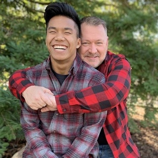 Jordan Windle — also known as "Little Louganis," a nickname that hearkens back to the out Olympic champion who took the gold in 1984 and 1988 — is headed to the Olympics in Tokyo this summer. And his out gay dad, Jerry Windle, will be there to watch him compete. Jordan's Olympic journey began, improbably enough, in his birthplace of Cambodia, NBC Sports recounted. His parents died when he was still an infant, but he was adopted by Jerry Windle, "an American who had reportedly struggled to adopt in the U.S. as a single, gay man." Per the article, Jerry "adopted Jordan when he was 18 months old and helped nurse him back to health from malnutrition, scabies, intestinal parasites and severe infections. When Windle was 7, he attended a summer camp where he was spotted by Tim O'Brien, the son of Hall of Famer diving coach Ron O'Brien." That connection seemed freighted with destiny, as it turned out. "O'Brien had seen something in Windle that reminded him of one of his father's most decorated divers: Four-time Olympic champion Greg Louganis," Olympics.com notes in its profile on Jordan. "It prompted the nickname 'Little Louganis.'" Jordan proved O'Brien right: He won "four U.S. junior titles," Outsports.com recalled. "Along the way, Jordan and Jerry co-authored a children's book based on their family experience called, 'An Orphan No More: The True Story of a Boy.'" Tap link in bio to continue on @EDGEmedianetwork ?️‍???‍♂️? (?️: Kilian Melloy / @dragelruairi , ?: Jordan Windle / Instagram / @jordanpiseywindle)