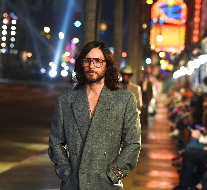 With stars like Gwyneth Paltrow and Serena Williams sitting in the front row, Alessandro Michele's nostalgic clothing designs inspired by old Hollywood glam shined just as bright during a Gucci fashion show in Los Angeles.⁠
⁠
Jared Leto and Macaulay Culkin were among the many models who calmly pranced down the Walk of Fame runway at the Gucci Love Parade on Tuesday night. It was such a splashy spectacle that the event shut down a few blocks of busy Hollywood Boulevard. Audiences included Salma Hayek, Lizzo, Miley Cyrus, Lindsey Vonn, Dwyane Wade, Gabrielle Union, James Corden, Dapper Dan, Tracee Ellis Ross and Tyler, the Creator.⁠
⁠
With his new collection, Michele brought his love for old cinematic wardrobes to life with cowboy hats, feathered gowns, faux fur coats, diamond tiaras, crop tops, wide leg pants and voluminous dresses. He offered a mixture of colors through his models who wore lavender, teal and hot pink suits along with metallic and gold gowns. Black was another color of preference.  Some models wore chunky silver platform shoes, patent leather flats and white pointy boots. Another popular accessary was face jewelry around the nose and cheekbones. The Italian designer also featured small to plus-sized models. ⁠
⁠
"I think with fashion, you have a duty to give a voice," Michele, the creative director of Gucci, said after the show. "I see beauty everywhere. It's something which is organic and natural." ⁠
⁠
Tap link in bio to continue on @EDGEmedianetwork ?⭐??⁠
⁠
?: Jared Leto walks the runway at the Gucci "Love Parade" fashion show / Jordan Strauss / AP